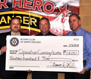 L-R: President Steven Nelson, Tim Minton (President of Operation Coming Home) and Scott Tarkenton with our BIG check for $1600 donated to OCH. The newly built home for Nathan is the 6th OCH with more to come. The returning vet does not pay anything for the house!